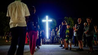 Locals attend a 'Via Crucis' (Way of the Cross) at the St. Gabriele dell'Addolorata sanctuary in Isola del Gran Sasso near Teramo in central Italy 