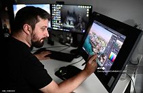 A graphic designer puts the final touches to a scene of Ubisoft's video game "Assassin's Creed Mirage" at the Ubisoft studio in Bordeaux