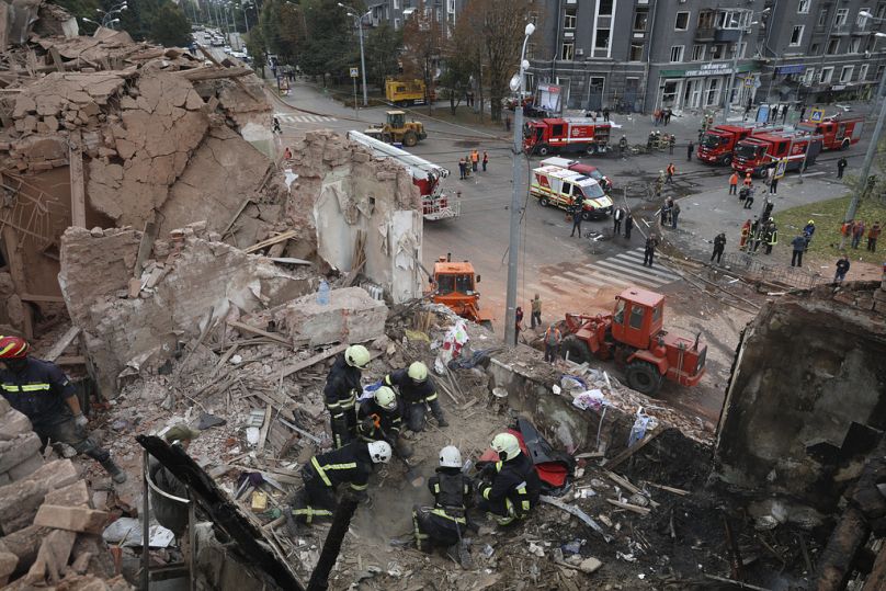 FILE: Emergency workers search for victims after a Russian rocket hit an apartment building in central Kharkiv, 6 October 2023