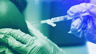 A pharmacist administers a Moderna Spikevax COVID-19 vaccine at a drug store, September 2023