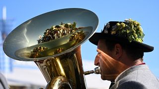 A brass musician plays his instrument during the the last day of the Oktoberfest beer festival in Munich, southern Germany, on October 3, 2023.
