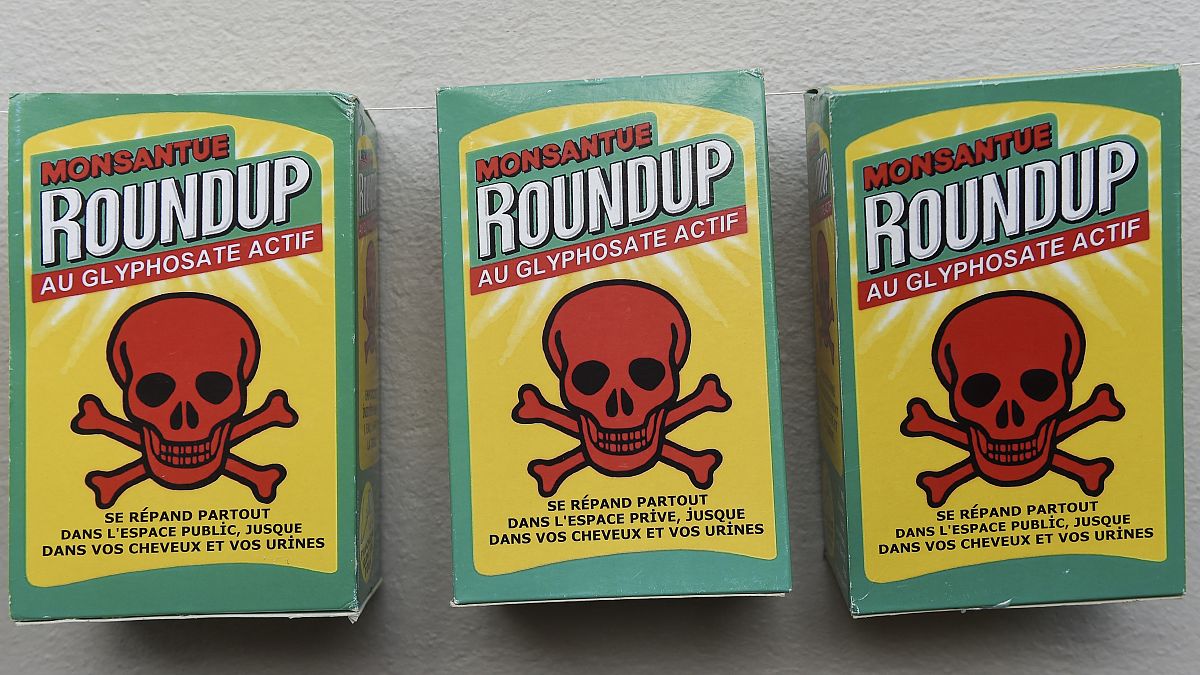  A fake bottle of Roundup herbicide is displayed at a demonstration in support of Mayor Daniel Cueff, who is being prosecuted for banning pesticides in Rennes.
