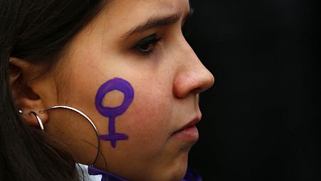 A woman takes part during a protest against sexism and gender violence in Madrid, Spain.