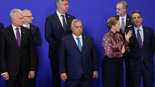 Hungary's Prime Minister Viktor Orban, centre stands alongside others during a group photo on the second day of the Europe Summit in Granada, Spain, Friday, Oct. 6, 2023.