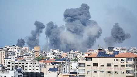 Smoke rises from an explosion caused by an Israeli airstrike in the Gaza Strip