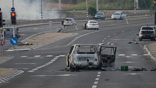 A car destroyed in an attack by Palestinian militants is seen in Sderot, Israel.