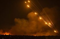 Rockets are fired toward Israel from the Gaza Strip, Sunday, Oct. 8, 2023
