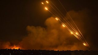Rockets are fired toward Israel from the Gaza Strip, Sunday, Oct. 8, 2023