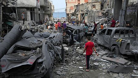 Palestinians inspect the rubble of the West mosque destroyed after it was hit by an Israeli airstrike at Shati refugee camp in Gaza City, early Monday, Oct. 9, 2023.