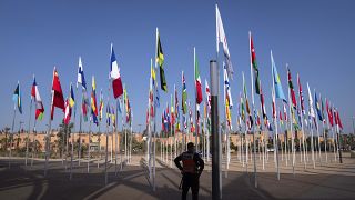 A member of the security forces stands guard outside a convention center hosting the IMF and World Bank annual meetings, in Marrakech, Morocco, Sunday, Oct. 8, 2023.