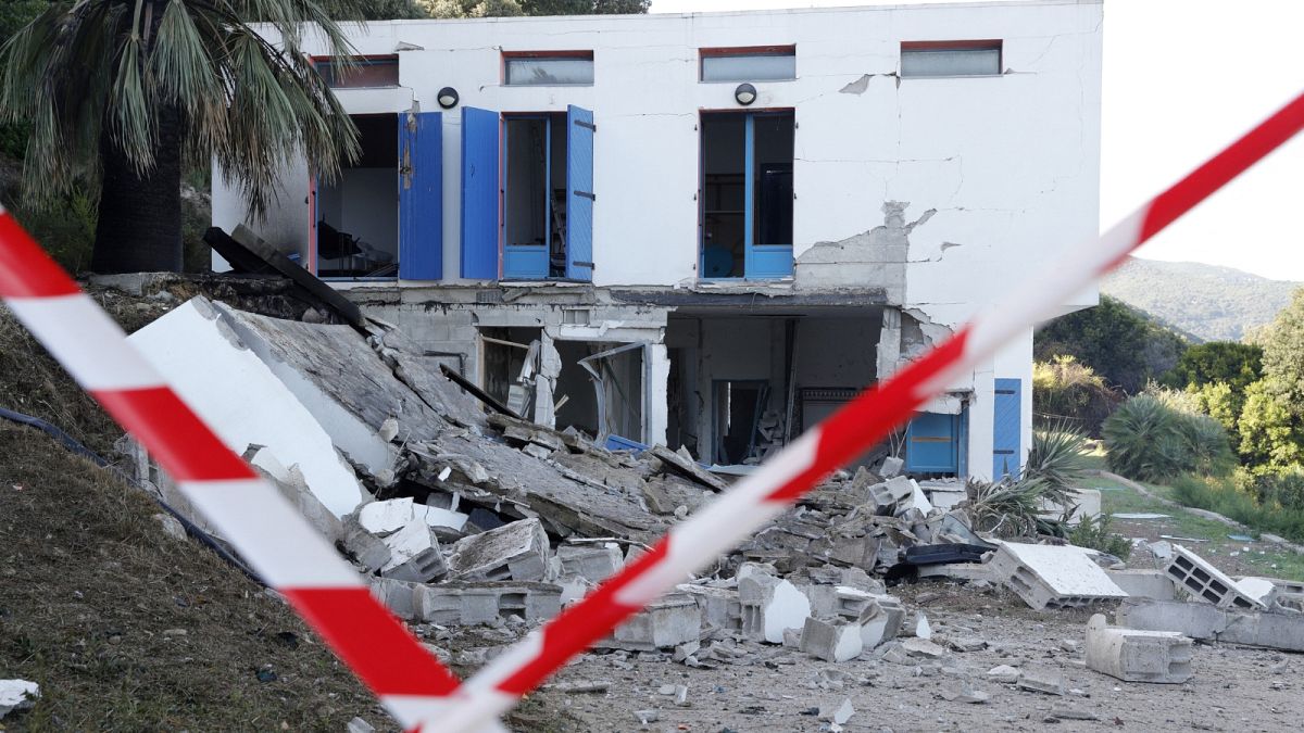 The area is cordonned off as debris lay strewn outside a damaged house, targeted by an explosion in Villanova, on the French Mediterranean island of Corsica on October 9, 2023