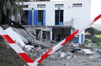 The area is cordonned off as debris lay strewn outside a damaged house, targeted by an explosion in Villanova, on the French Mediterranean island of Corsica on October 9, 2023