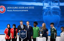UEFA president Aleksander Ceferin, fourth left, shows the name of UK and Ireland elected to host the Euro 2028 fooball tournament with Gareth Bale