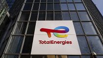 The logo of TotalEnergies is seen at the company's headquarters skyscraper in the La Defense business district in Courbevoie near Paris, France, Wednesday, March 1, 2023. 