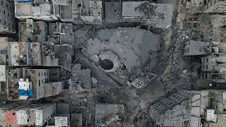The rubble of the Sousi Mosque, destroyed in an Israeli airstrike, is seen at Shati refugee camp in Gaza City early Monday