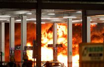 Flames are seen as emergency services respond to a fire in Terminal Car Park 2 at London Luton airport in Luton, Britain, 10 October, 2023. 