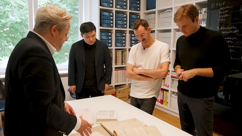 Matthias shows the finalists documents of Herbert von Karajan's career