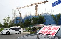 Homeowners protest in front of Country Garden's One World City project under construction on the outskirts of Beijing, in August.