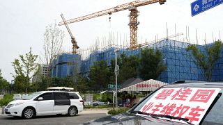 Homeowners protest in front of Country Garden's One World City project under construction on the outskirts of Beijing, in August.