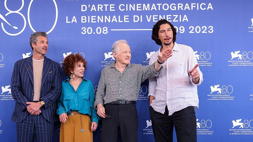 Michael Mann (second from right) and Adam Driver (right) in Venice for the premiere of 'Ferrari'