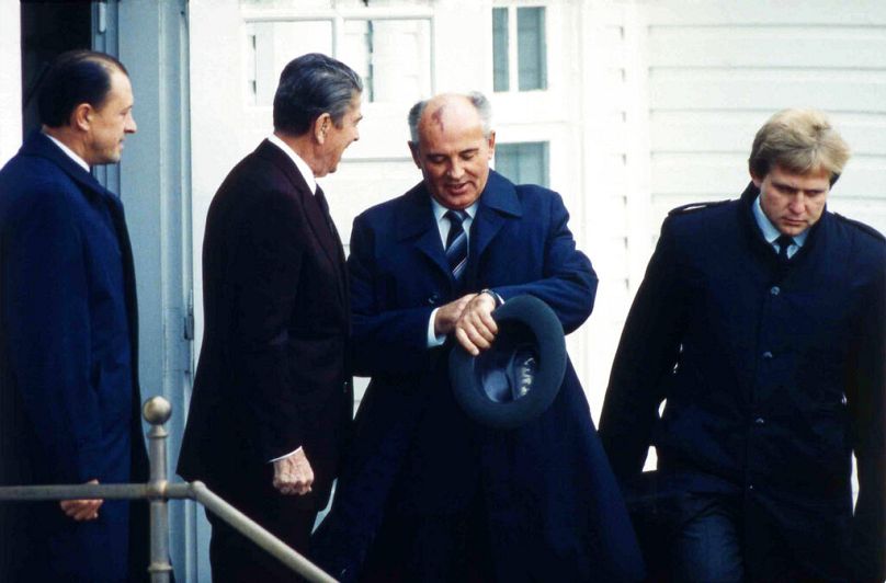 Soviet Leader Mikhail Gorbachev, looking at his watch, and US President Ronald Reagan in Reykjavik, October 1986
