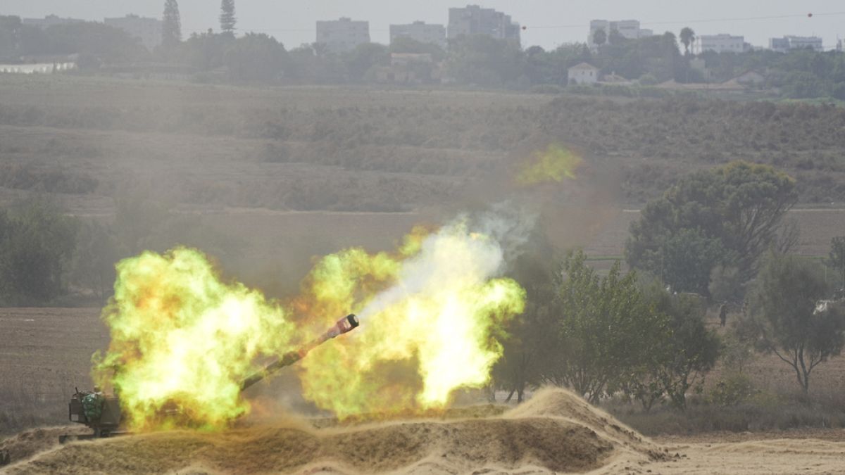 An Israeli howitzer fires at the Gaza Strip from the south of Israel on Thursday, Oct. 12, 2023. 