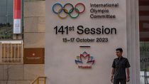 A security guard stands at the entrance of a venue ahead of the 141st International Olympic Committee (IOC) session in Mumbai, India.