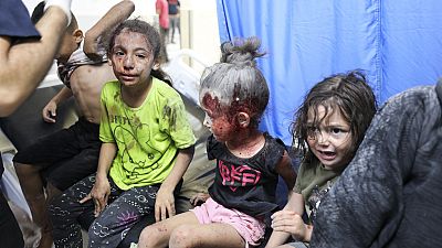 Palestinian children wounded in Israel strikes are brought to Shifa Hospital in Gaza City on Wednesday, Oct. 11, 2023.