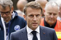 French President Emmanuel Macron talks to the press at the Gambetta high school in Arras.