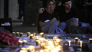 People light candles during the 'Jewish Community Vigil' for Israel in London, Monday, Oct. 9.