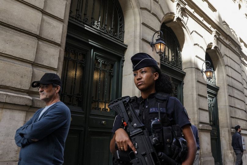 A French police officer carrying a G36 assault rifle patrols outside the Tournelles Synagogue, after increased security measures were put in place at Jewish temples.