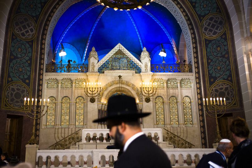 In this Friday, Nov. 9, 2018 file photo a rabbi arrives at the synagogue Rykestrasse in the district Prenzlauer Berg in Berlin.