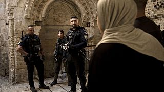 Israeli police wait to check Palestinian worshippers’ ID ahead of Friday prayers at the Al-Aqsa Mosque compound in the Old City of Jerusalem, Friday, Oct. 13, 2023