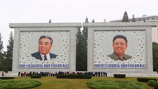 FILE - Citizens visit the portraits of the country's late leaders Kim Il Sung and Kim Jong Il on the occasion of the 78th founding anniversary of the Worker's Party of Korea