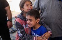 Children crying following Israeli raids in Khan Yunis, Gaza on Sunday