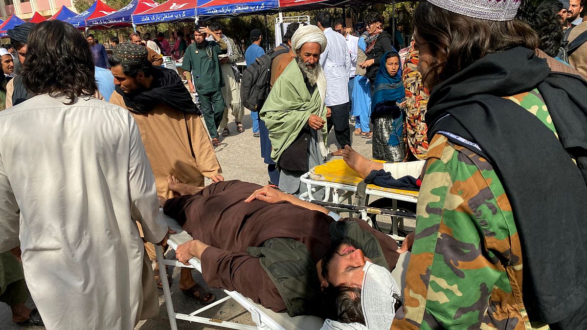 Injured Afghan people being brought to a hospital following earthquake in Herat on Sunday