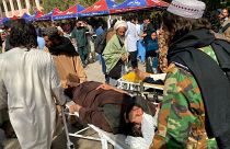 Injured Afghan people being brought to a hospital following earthquake in Herat on Sunday