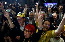Supporters of the Third Way, a coalition of the centrist Poland 2050 party and the agrarian Polish People's Party celebrate at the electoral headquarters in Warsaw, Poland