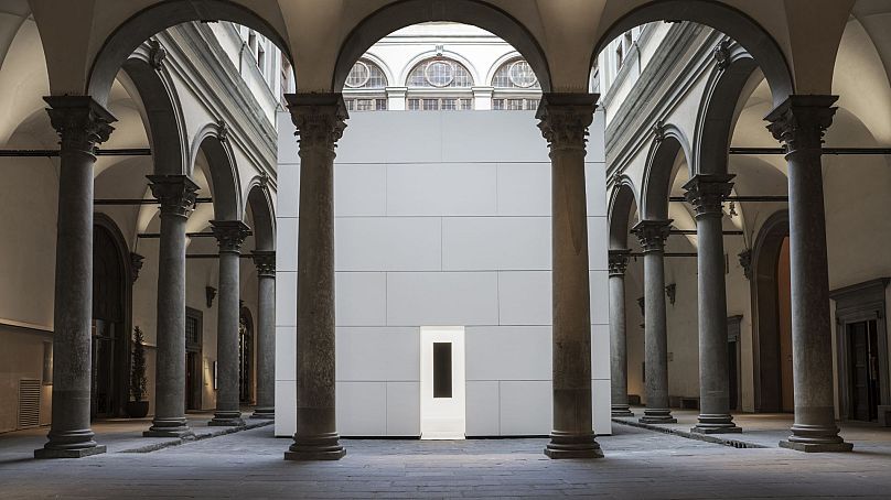 The Renaissance courtyard of the Palazzo Strozzi, displaying Void Pavillion VII by Anish Kapoor.