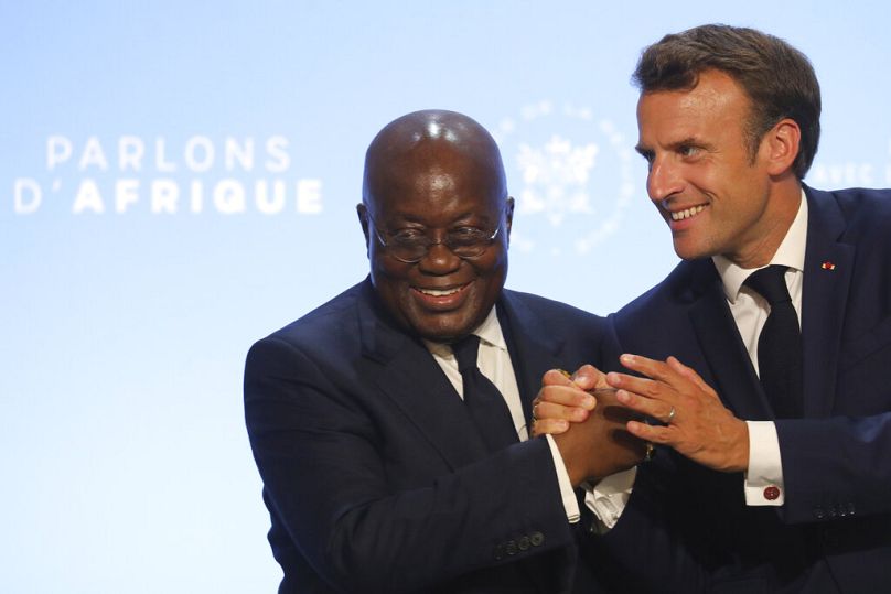 French President Emmanuel Macron shakes hands with Ghana President Nana Akufo-Addo in Paris, July 2019