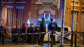 Belgium police stand at the site of a shooting incident in the Ieperlaan - Boulevard d'Ypres, in Brussels, on October 16, 2023.