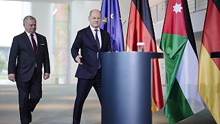 German Chancellor Olaf Scholz, right, and Jordan's King Abdullah II arrive for a news conference after a meeting at the chancellery in Berlin, Germany, Tuesday, Oct. 17, 2023.