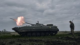 FILE - A Ukrainian APC fires towards Russian positions near Avdiivka, in the Donetsk region, Ukraine, Friday, April 28, 2023