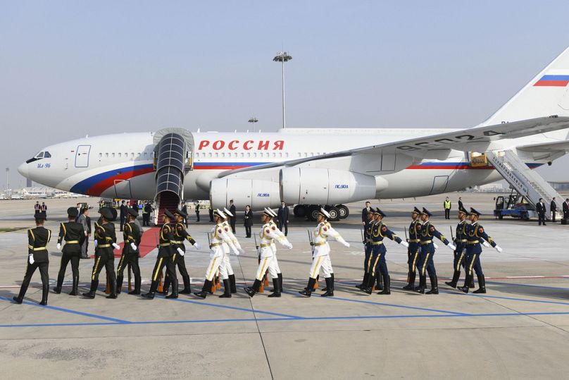 Chinese honour guards march to welcome Russia's President Vladimir Putin on his arrival at Beijing Capital International Airport.
