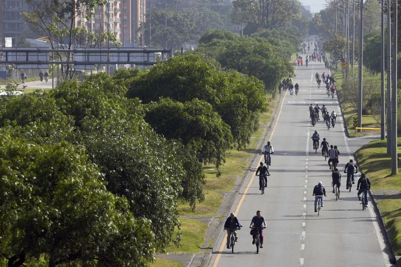 Residents bike and walk on the annual car-free day in Bogota, Colombia, 21 September 2023.
