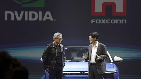 Co-founder, president and CEO of Nvidia Corporation Jensen Huang, left, and Foxconn chairman Young Liu, right.