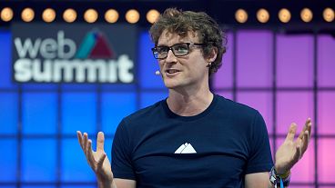 Paddy Cosgrave, CEO and founder of Web Summit, speaks at center stage during the opening of the Web Summit technology conference in Lisbon, Monday, Nov. 1, 2021. 