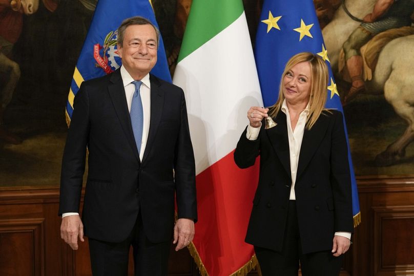 Italian Premier Giorgia Meloni flanked by former PM Mario Draghi, Chigi Palace premier's office, in Rome, Sunday, Oct. 23, 2022