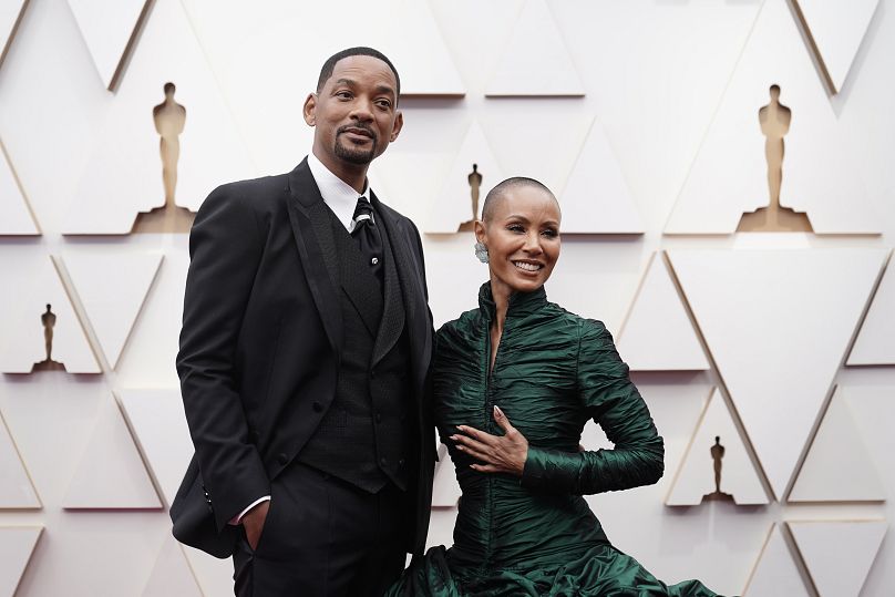 Will Smith, left, and Jada Pinkett Smith arrive at the Oscars on Sunday, 27 March 2022, at the Dolby Theatre in Los Angeles.