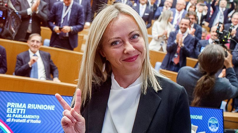 Leader of the Brothers of Italy party Giorgia Meloni gives the victory sign as she attends a meeting with elected parliamentarians, in Rome, Monday, Oct. 10, 2022.